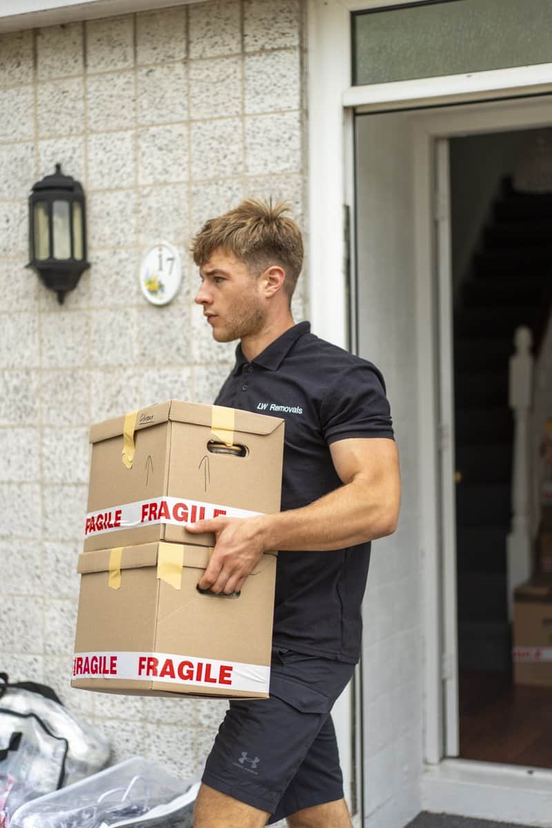 LW Removals team loading a single item into the removal van